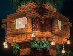 a tree house with lights hanging from it's sides and trees growing on the outside