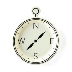 a white and black clock hanging on the wall