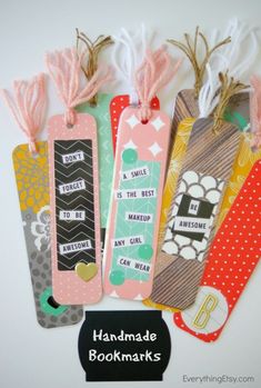 handmade bookmarks are lined up on a table