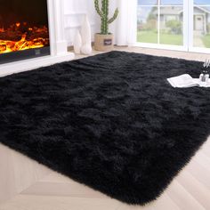 PRICES MAY VARY. Material and Size: The carpet has super soft shaggy surface, non-slip plastic spots bottom, makes you feel like lying on the clouds, 4 feet x 5.3 feet / 48 inches x 64 inches, it's available in a choice of colors and sizes Super Soft Feeling: Our shaggy and fluffy area rugs are elegant in texture and soft to the touch, this fluffy carpet provides a tranquil refuge for your family to rest their body and mind after a hectic day Multi-purpose: Embellish your floors with this shag r Room Makeover Bedroom Ideas, Black Rug Living Room, Daily Square, Fuzzy Rugs, Fluffy Bedroom, Bilik Permainan, Fuzzy Rug, Carpets For Kids, Fluffy Rug