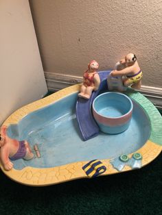 a toy bathtub with two people in it