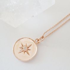 A pendant necklace featuring a celestial starburst dotted with a tiny crystal in its center. Length: adjustable between 21"- 24". Charm measures .5" x .5". Our materials make for an amazing, high quality, seamless, jewelry piece with longevity. Our necklaces are plated with 18k gold, 18k rose gold, or rhodium and finished with a protective coating. A little secret we’ll keep between us: it looks way more than it costs. Cat Charm Necklace, North Star Necklace, Lucky Charm Necklace, Starburst Necklace, Star Necklace Gold, Silver Bar Necklace, Toggle Necklace, Charm Necklace Silver, Gold Bar Necklace