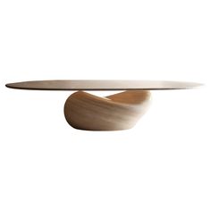 an oval table with a wooden base and curved glass top, on a white background