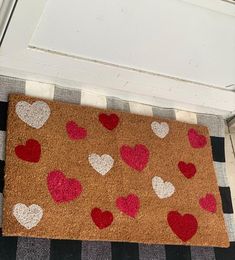 a door mat with hearts on it