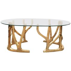 a glass table with gold branches on it