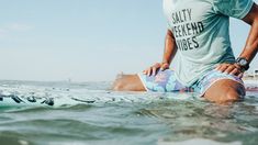 Salty Weekend Vibes beach bun Athleisure Short Sleeve Tops For Vacation, Athleisure Summer Surfing Tops, Summer Surfing Athleisure Tops, Moisture-wicking Tops For Surfing In Summer, Summer Moisture-wicking Tops For Surfing, Summer Workout Graphic Tee T-shirt, Summer Moisture-wicking Surf Tops, Moisture-wicking Crew Neck T-shirt For Beach, Stretch Graphic Print T-shirt For Beach