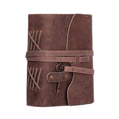 a brown leather journal with an arrow and key on the front, tied up to it