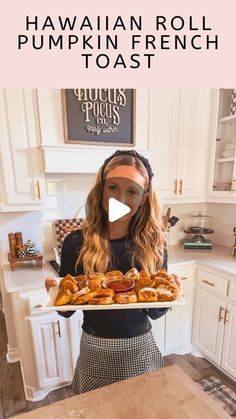 a woman holding a tray full of baked goods in her kitchen with the words hawaiian roll pumpkin french toast