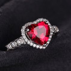 Red Round Jewelry For Valentine's Day, Red Heart-shaped Birthstone Jewelry, Red Heart Diamond Ring For Anniversary, Red Heart Shaped Diamond Anniversary Ring, Red Heart-shaped Cubic Zirconia Jewelry, Heart-shaped Diamond Ring For Anniversary, Red Diamond Heart Ring For Anniversary, Heart Cut Ruby Jewelry, Elegant Red Heart-shaped Diamond Ring