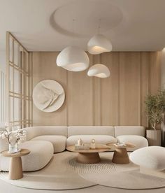 a living room filled with white furniture and lots of round lights hanging from the ceiling