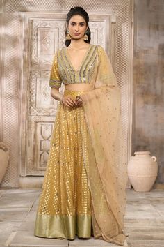 Ochre lehenga with floral pattern woven motifs. Comes with mirror embroidered blouse and butti embroidered dupatta. - Aza Fashions Woven Mirror, Yellow Mirror, Party Wear Lehenga, Embroidered Dupatta, Embroidered Blouse, Set For Women, Aza Fashion, Western Fashion, Lehenga