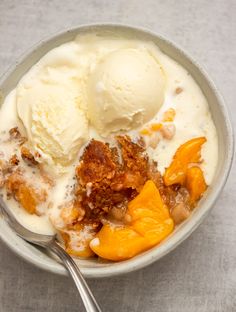 a bowl filled with ice cream and fruit