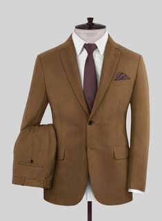 Be your confident, sharp self for all business affairs with our terrific Reda Tan Wool Suit. Expertly crafted from pure wool, it boasts a fine glaze, excellent drape, and inimitable wearing comfort. The suit's silhouette adds a definitive fashion edge, while its earthy tan color woven into a plain weave makes it a key Brown Wool Suit With Welt Pockets, Tailored Brown Wool Suit, Brown Wool Suits With Suit Collar, Tailored Brown Three-piece Suit With Notch Lapel, Timeless Brown Wool Suits, Formal Brown Three-piece Suit With Welt Pockets, Brown Flat Front Suits For Formal Occasions, Wool Suits With Notch Lapel, Fitted Solid Suits For Fall