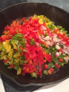 chopped vegetables are in a frying pan on the stove top, ready to be cooked