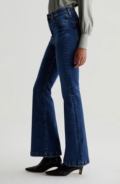 Rock a chic, '70s-inspired look in cleanly styled jeans flaunting a superhigh waist and full-length flared legs that create a dramatic silhouette. 33" inseam, 22" leg opening; 11" front rise Zip fly with button closure Five-pocket style 98% cotton, 2% elastane Machine wash, tumble dry Imported Retro Flares With Flared Hem, Modern Fitted Flare Jeans, Retro High Rise Flares For Fall, Modern High Rise Flare Jeans For Fall, Modern Full-length Flare Jeans For Fall, Modern High Waist Flare Jeans, Modern Flare Jeans, Styled Jeans, High Waist Flare Jeans