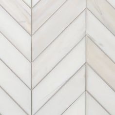 white marble herringbone tile with grey veiners