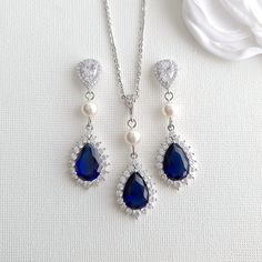 Elegant Sapphire Blue Gold Wedding Jewelry Set with Pearls This is beautiful sapphire blue wedding jewelry set in gold and pearls perfect for brides, weddings, and special occasions. This blue jewelry set is also available in silver, and gold colors, and the pearls are available in white/ ivory or cream color pearls. They can also be purchased as earrings, necklaces, and bracelets or in the combination of your choice. Blue Bridal Earrings- In teardrop shapes, the earrings are made with clear spa Sapphire Blue Wedding, Blue Bridal Jewelry, Sapphire Blue Weddings, Blue Bridal Earrings, Blue Gold Wedding, Blue Jewelry Set, Blue Wedding Jewelry, Blue Sapphire Jewelry, Wedding Jewelry Set