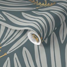 a wallpaper with gold and silver designs on the surface, including an animal print