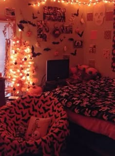 a bedroom decorated with halloween decorations and lights