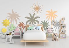 a bedroom decorated in pastel colors with palm trees and animals on the wall behind it