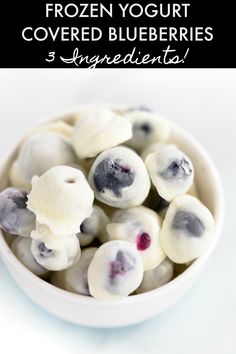 frozen yogurt covered blueberries in a white bowl with text overlay that reads frozen yogurt covered blueberries 3 ingredients