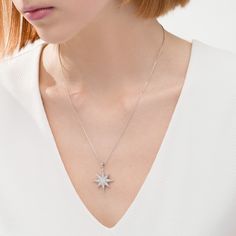 A beacon of style, this diamond pendant emits beguiling beauty. Created in sterling silver, this dazzling design showcases a sculpted eight-pointed star dangle sparkling with diamonds. Radiant with 1/2 ct. t.w. of diamonds and a bright polished shine, this pendant suspends along an 18.0-inch box chain that secures with a spring-ring clasp. Elegant Sparkling Star-shaped Jewelry, Elegant Sparkling Star Shaped Jewelry, Elegant White Gold Star Diamond Necklace, Elegant Star-shaped White Gold Diamond Necklace, Elegant Star Shaped White Gold Diamond Necklace, Silver Star-shaped Diamond Necklace With Accents, Silver Diamond Star Of David Necklace, White Gold Diamond Jewelry With Star Charm, Sparkling Star-shaped White Gold Jewelry