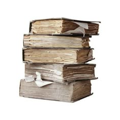 a stack of old books with torn pages and paper on top, against a white background