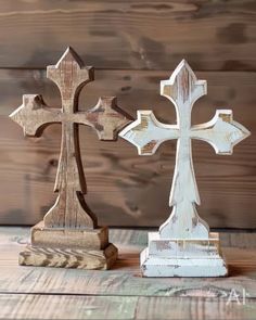 two wooden crosses sitting next to each other