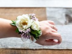 a woman's arm with flowers on it