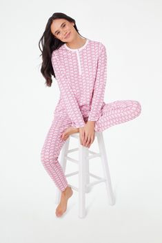 Give yourself a chance to unwind and relax in the cozy comfort of our Hathi Pajamas. This set includes a long-sleeve henley-style top and matching bottoms, each crafted entirely from the softest cotton and embellished with a unique color twist on our original classic and playful elephant print. 4 Snaps Elastic Waistband Super-Smooth Flatlock Seams Materials and Care 100% Premium Cotton Cold Wash, with like colors. Do not bleach Tumble dry low (Line dry recommended). Warm iron if needed Imported Roller Rabbit Elephant, Color Twist, Roller Rabbit, Elephant Print, Sleepwear & Loungewear, Classic Pattern, Comforters Cozy, Unique Colors, Pink Color