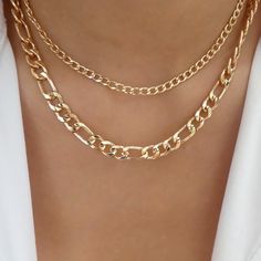 Attached layers Includes everything pictured Material: gold plated brass Length: 14" + 3" extension IMPORTED Luxury Fine Jewelry Station Necklace With Cable Chain, Gold Layered Necklace With Chunky Chain Links, Trendy Gold Plated Layered Necklace With Adjustable Chain, Metal Figaro Chain Necklace For Layering, Gold Double Strand Layered Necklace With Chunky Chain, Trendy Gold Layered Necklace With Double Chain, Trendy Gold Layered Double Chain Necklace, Trendy Gold Layered Choker Necklace, Trendy Gold Layered Necklace With Figaro Chain