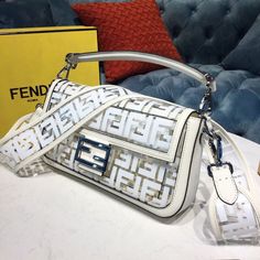 FND Baguette Nappa White For Women, Women’s Handbags, Shoulder And Crossbody Bags 10.6in/27cm FF 8BR600A72VF15AO Rep 1:1 Iconic medium Baguette bag made of white soft nappa with a three-dimensional texture FF motif. The bag can be carried by hand, or worn either on the shoulder or cross-body thanks to the handle and shoulder strap, both detachable. Size: 27 x 6 x 15 cm / 10.6 x 2.3 x 5.9 inches (Length x Width x Height) White. Featuring a front flap. Magnetic clasp. Internal compartment wi Louis Vuitton Shirt, Chanel Shirt, Womens Handbags, Fendi Baguette, Luxury Products, Baguette Bag, Evening Clutch Bag, Fendi Bags, Magnetic Clasp