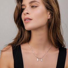 If you're looking for an accessory with unmatched style then look no further than our Ini MIni Dogtag Necklace. A style that is sure to become your stack staple, this dainty shape gets a trendy makeover with a gorgeous link chain. With 1 - 5 mini tags and a personalized engraving with an ethically sourced diamond, this classy silhouette can represent anyone's loved one that you want to keep close to your heart. If you prefer something old-fashioned yet still stylish, we've got it all - take your Sterling Silver Chain Necklace For Everyday Luxury, Sterling Silver Charm Necklaces With Box Chain, Sterling Silver Box Chain Charm Necklaces, Sterling Silver Charm Necklace With Box Chain, Everyday Necklace With Rectangular Pendant, Tarnish Resistant Necklace With Rectangular Pendant, Everyday Jewelry With Rectangular Clavicle Chain Pendant, Formal Tarnish-resistant Charm Necklace, Timeless Rectangular Pendant Jewelry