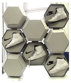 an assortment of nike shoes are arranged in hexagonal boxes to look like hexagons