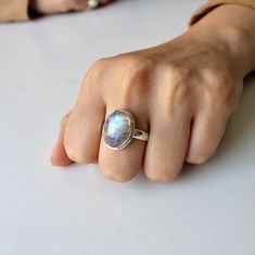 AAA Rainbow Moonstone ring, Real Sterling Silver ring, cocktail ring, alternative engagement ring, avant garde, birthstone ring, Rainbow Moonstone jewellery Description: Be assured that the product you order is MADE JUST FOR YOU and is not a mass produced item. The gemstone is a OVAL shaped AAA RAINBOW MOONSTONE GEMSTONE SIZE-16*12 mm. You have an option to choose a gem for yourself from a set of the stones. Please ask. The rest of the ring is made from 925 STERLING SILVER. And it DOESN'T HAVE A Mystical Iridescent Sterling Silver Rings, Handmade Open Moonstone Ring In Fine Jewelry Style, Handmade Moonstone Open Ring Fine Jewelry, Handmade Open Moonstone Ring Fine Jewelry, Unique Iridescent Moonstone Ring For Gift, Iridescent Gemstone Rings In Fine Jewelry Style, Iridescent Moonstone Ring In Sterling Silver, Iridescent Sterling Silver Moonstone Ring, Unique Iridescent Gemstone Rings