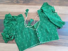 Blouse stitched - Yes Blouse Opening - Back Padded - No Blouse size - 38 with inner margins expandable upto 44 For Blouse Size 36 alteration can be done on request. Elegant Green Cotton Blouse, Summer Fitted Cutdana Blouse, Elegant Cotton Blouse With Cutdana Detailing, Green Ruffled Sleeveless Blouse, Green Sleeveless Ruffle Blouse, Fitted Green Blouse With Cutdana Details, Green Summer Blouse With Cutdana Details, Green Cutdana Blouse For Summer, Green Fitted Sleeveless Blouse