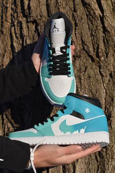 Custom made Jordan 1s. Starts with a gift box blue and fades into a turquoise with a dripping Nike symbol. Shoe represents melting ice. Prices are higher because the base shoes are a lot harder to get as the growing popularity of Jordan 1 mid increases. If you want the same design on a airforce 1 mid just select that option! The picture is just a mock-up and the real shoe will be the same colors as the Jordan 1 mid! Made with Angelus paint, paint is permanent. If you choose to receive a custom b Blue Low-top Sneakers For Gift, Airforce 1 Mid, Custom Made Jordans, Jordan Original, Air Jordan 1 Blue, Gift Box Blue, Custom Jordan, Custom Air Jordan 1, Jordan 1 Blue