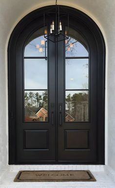 a black double door with two sidelights