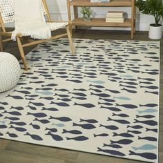 Complement your coastal decor with this Mod-Tod area rug. The plush polypropylene pile is detailed with a fish pattern for nautical charm. Stain-resistant and non-shedding, the durable carpet is ideal for busy living areas or kid's playrooms. Features: Made of polypropylene Nautical, coastal style Fish pattern Cream or navy color Machine-made Indoor only Kid and pet-friendly Stain-resistant Non-shedding Suitable for high-traffic areas 0.25-0.5-inch pile height See options for available sizes Siz Coastal Area Rug, Coastal Area Rugs, Rug Cream, Durable Carpet, Target Rug, Navy Blue Area Rug, Blue Area Rug, Blue Area