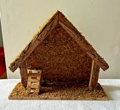 a small house made out of wood shavings