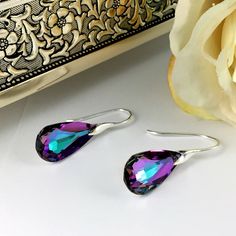 "A stunning handcrafted  statement piece for a trendy and sophisticated look. This eye-catching earrings made with Swarovski crystal teardrop and .925 sterling silver earwires . Perfect earrings for birthday, anniversary,  brides and bridesmaids. Earrings are also available in other colour options Length: 1.5\"inches  Colour: Lilac Earrings will be carefully packaged in a jewellery box ready for giving. EAR045 Jewellery Care: *To prevent your metals, gemstones and pearls from scratching and tarnishing, we recommend keep your jewellery in individual boxes or soft pouches and store these in a cool, dry place. * Keep all of your metal and gemstones well away from domestic cleaning products and avoid contact with things like perfume and hairspray. All items are created with special care and at Formal Faceted Teardrop Earrings, Sterling Silver Teardrop Earrings With Sparkling Stones For Party, Faceted Teardrop Crystal Earrings For Parties, Teardrop Crystal Earrings As A Gift, Sterling Silver Teardrop Earrings With Sparkling Stones For Gift, Gift Sterling Silver Teardrop Earrings With Sparkling Stones, Teardrop Faceted Crystal Earrings For Formal Occasions, Faceted Teardrop Crystal Earrings For Formal Occasions, Faceted Teardrop Crystal Earrings For Formal Events