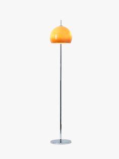 a floor lamp with an orange shade on it's base and a white background