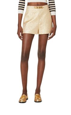 Sitting high on the waist, this pair of gold-tone tailored shorts from Valentino are detailed with the brand's signature VLogo signature logo plaque to the front. Crafted with a touch of silk, they feature a concealed side zip fastening and two inseam side pockets.Textured finishVLogo SignatureChain-link detailingHigh waistTwo side inset pocketsSide zip fasteningComposition: Polyester 39%, Silk 33%Lining: Viscose 63%, Silk 37%Outer: Metallic Fibre 28%Length from waist 34 cm / 13.3"Leg opening 69 Luxury Workwear Shorts, Luxury Short Length Bottoms For Workwear, Luxury Short Length Workwear Bottoms, Luxury Formal Summer Bottoms, Luxury Summer Formal Bottoms, Summer Formal Luxury Bottoms, Gold Bottoms With Built-in Shorts For Summer, Gold Formal Bottoms, Elegant Gold Bottoms For Summer