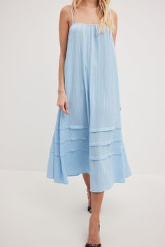 This midi dress features a flowy fit. It has a round neckline and adjustable, thin shoulder straps. This midi dress features ruffle details at the bottom. Midi Dress Wedding Guest, Crystal Wedding Dress, Midi Dress Blue, Plum Dress, Flowy Midi Dress, Marine Uniform, Fall Wedding Guest, Midi Dress Style, Blue Wedding Dresses