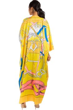 Introducing our Yellow Maxi Kimono, perfect for adding a pop of color to any outfit. Made from lightweight and breathable material, it features a oversized fit and a flowing silhouette. Ideal for both casual and formal occasions, this kimono is a versatile addition to your wardrobe. Bat wing sleeves Open front Maxi length One size Small-4X Casual Silk Kimono For Summer, Casual Silk Spring Kimono, Casual Silk Kimono For Spring, Spring Silk Kimono For Daywear, Spring Kaftan With Kimono Sleeves, Free Size, Spring Kaftan With Kimono Sleeves In Free Size, Oversized Silk Kimono, Chic Printed Kaftan For Spring, Spring Free Size Kaftan With Kimono Sleeves