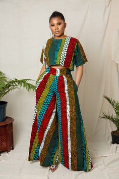 This exquisite outfit is an ideal choice for any occasion, be it a date, hangouts, work, church, dinner, movie night, birthday, wedding or any party. Its versatility ensures it's the perfect fit for every occasion. Features: - Crafted by hand from 100% African wax cotton As always, our designs are completely handmade and can be customized to your liking, this means you're welcome to request alterations, whether it's custom lengths for petite or tall individuals, design element additions or removals, or a different fabric selection. Just get in touch with us and we will be happy to take any special request. For the best fit, you can provide your measurements or select your size from our accurate size chart. Don't forget to include your height when ordering to ensure the perfect length. Care Summer Multicolor Two-piece Pant Set, Casual Multicolor Party Sets, Cotton Two-piece Set With Short Sleeve, Casual Multicolor Printed Pant Set, Fitted Multicolor Printed Pant Set, Multicolor Long Sleeve Matching Pant Set, Multicolor Short Sleeve Matching Pant Set, Casual Multicolor Two-piece Sets, Multicolor Matching Short Sleeve Pant Set