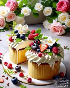 two cupcakes with white frosting and fresh berries on top, surrounded by flowers