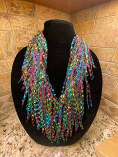 Scarf/Necklace  Colors:  Jasmine - beautiful "bright" shades of blues, pinks, greens & yellows. Check out my shop for many other colors.  If don't see a color, please ask🙂 Handmade, lightweight - made from ladder yarn (nylon & lurex) Approximately 68" in length. Can be worn as an Infinity (double loop), Pull-through  or just let it hang. Perfect item  to dress up any outfit. Unique Multicolor Summer Necklaces, Multicolor Fun Beaded Necklaces For Party, Fun Multicolor Beaded Necklaces For Parties, Fun Multicolor Beaded Necklace For Parties, Fun Multicolor Beaded Party Necklaces, Multicolor Fun Necklaces For Summer, Fun Multicolor Necklaces For Summer, Funky Multicolor Beaded Necklace, Funky Multicolor Festival Necklaces