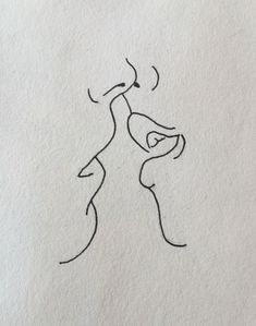 a drawing of two people kissing each other with one holding the other's hand