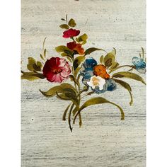 an old painting with flowers painted on it